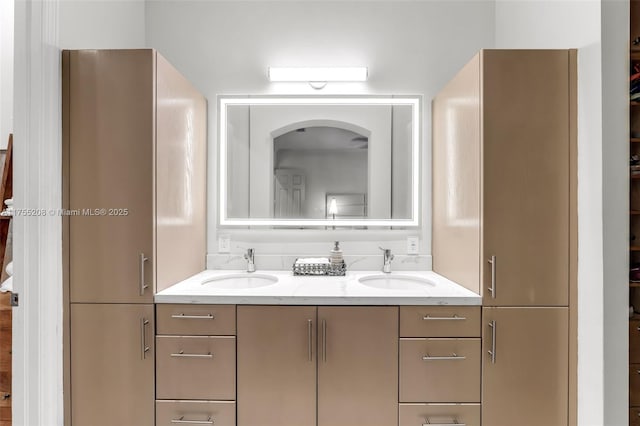 bathroom with double vanity and a sink