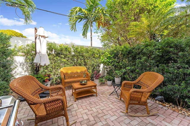 view of patio featuring fence