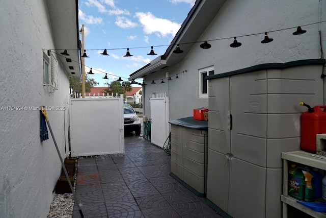 exterior space featuring a patio area and stucco siding