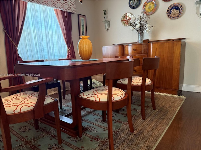 bar with baseboards and wood finished floors