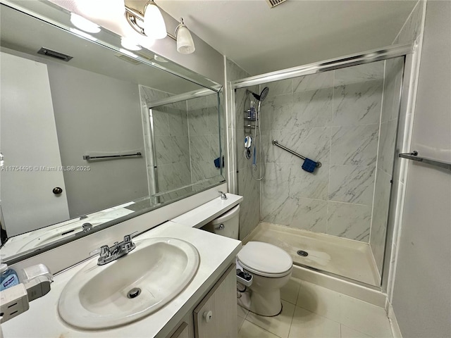 full bathroom featuring toilet, visible vents, vanity, tile patterned floors, and a stall shower