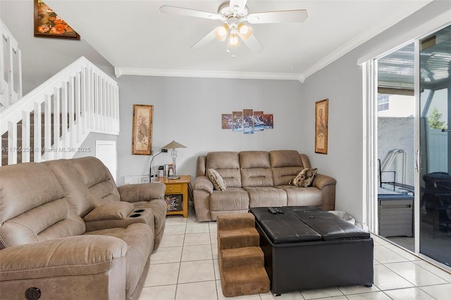 living room with stairway, a ceiling fan, crown molding, and light tile patterned flooring