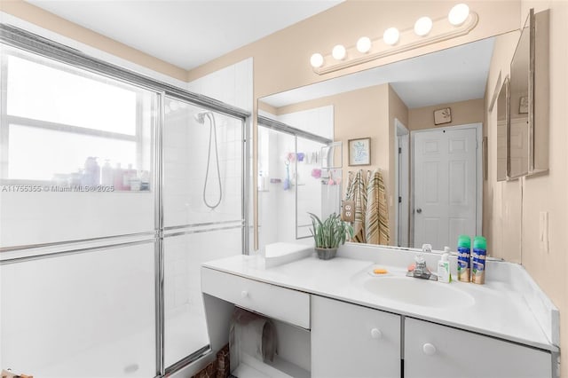 full bathroom featuring a stall shower and vanity