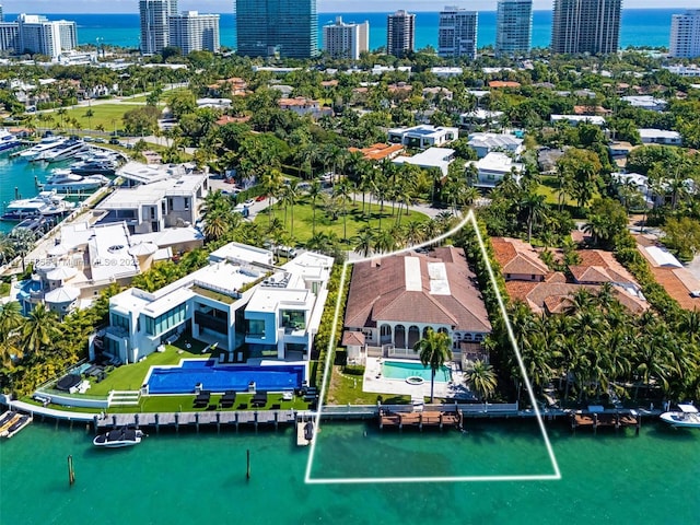 aerial view featuring a view of city and a water view