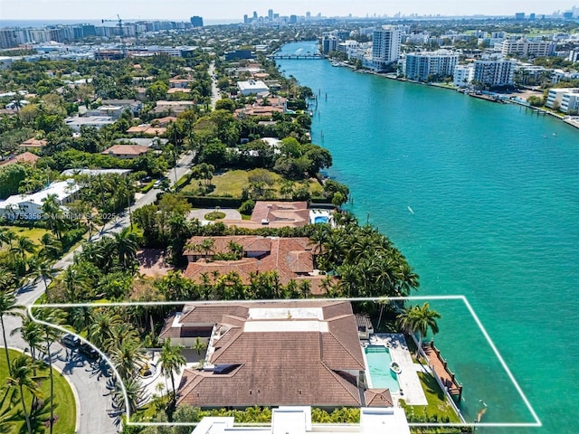 drone / aerial view with a view of city and a water view