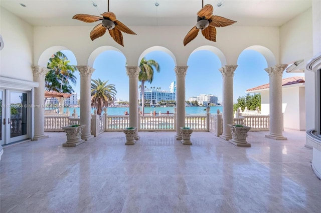 view of patio featuring french doors and a water view