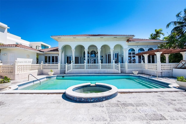 back of house featuring a tiled roof, a patio area, stucco siding, and fence