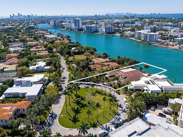 aerial view featuring a view of city and a water view