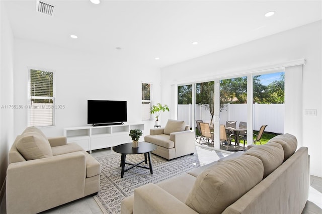 living area with recessed lighting and visible vents