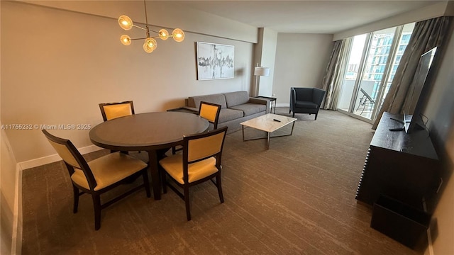 dining area featuring expansive windows, dark wood finished floors, and baseboards