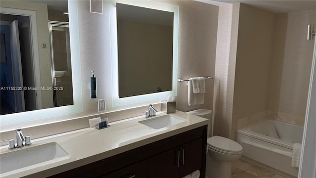 full bathroom with toilet, a washtub, an enclosed shower, and a sink