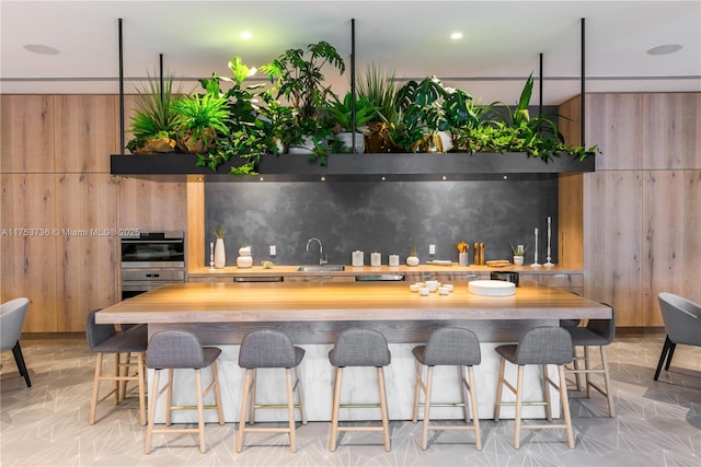 kitchen with a breakfast bar and a sink