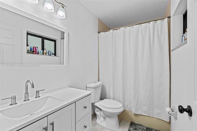 full bathroom with curtained shower, vanity, and toilet