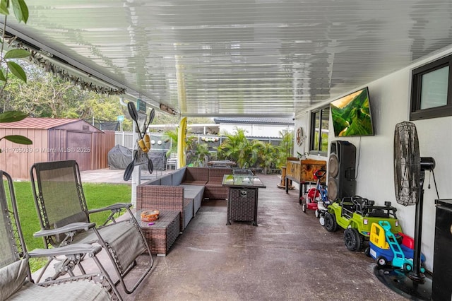 view of patio featuring fence and an outdoor hangout area