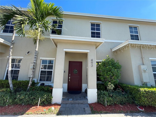 view of front of home featuring stucco siding