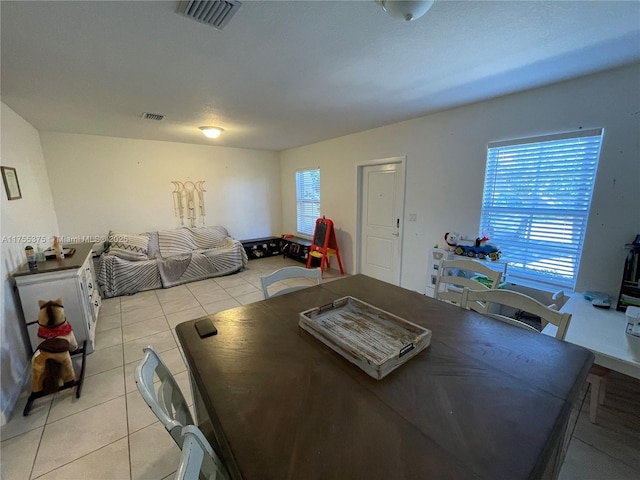 dining room featuring visible vents and light tile patterned floors