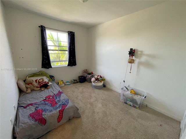 carpeted bedroom with baseboards