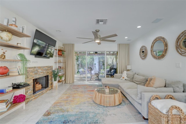 living room with a ceiling fan, recessed lighting, visible vents, and a fireplace