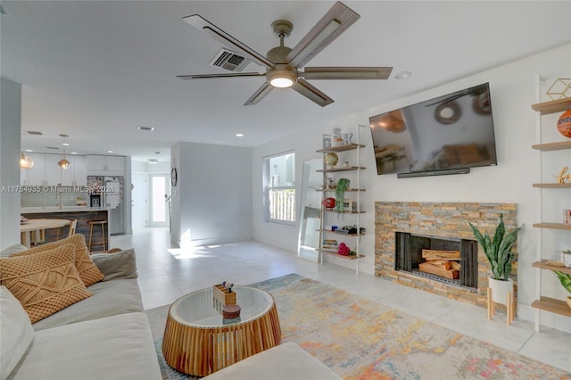 living room with a fireplace, recessed lighting, visible vents, a ceiling fan, and light tile patterned flooring