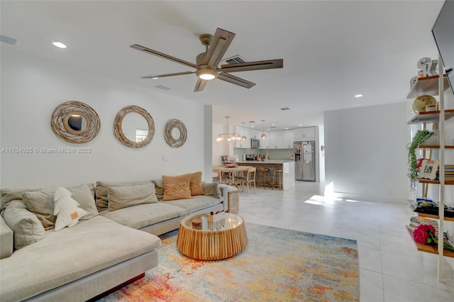 living area featuring a ceiling fan, recessed lighting, and light tile patterned floors