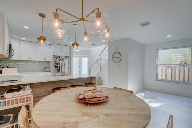 dining area featuring stairway, recessed lighting, visible vents, and baseboards