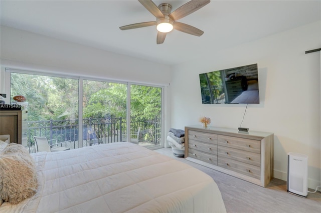 bedroom with a ceiling fan and baseboards