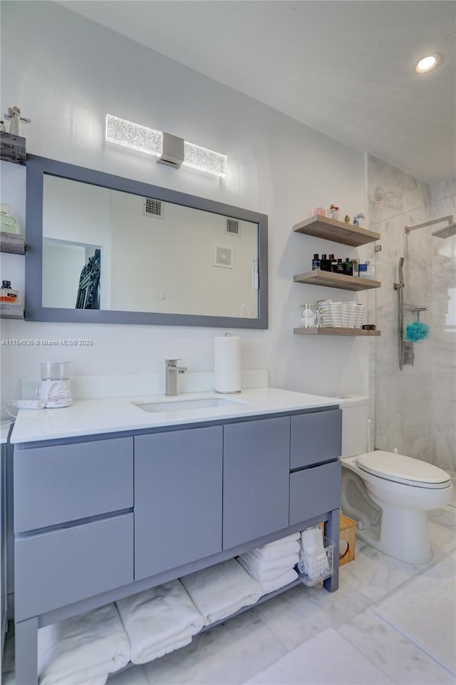 full bath featuring marble finish floor, visible vents, a shower stall, and vanity