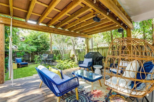 deck featuring grilling area, a fenced backyard, and an outdoor living space