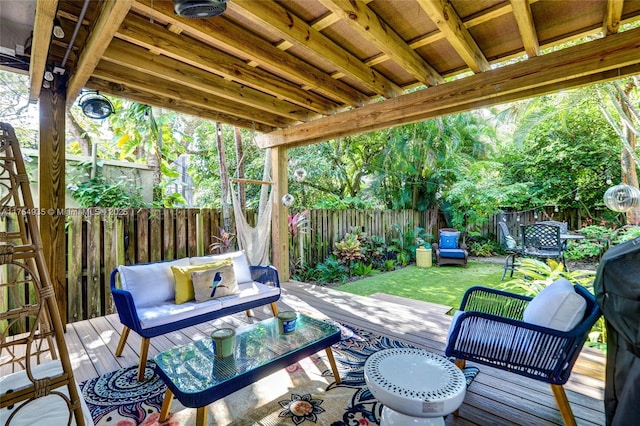 view of patio with a fenced backyard, an outdoor living space, and a wooden deck