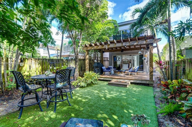 view of yard with a fenced backyard, a deck, and a pergola