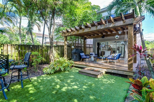 view of yard featuring a fenced backyard, a pergola, and a wooden deck