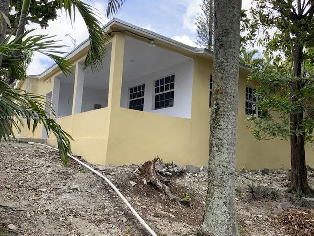 view of home's exterior with stucco siding