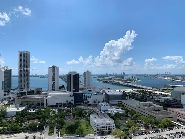 exterior space with a water view and a city view