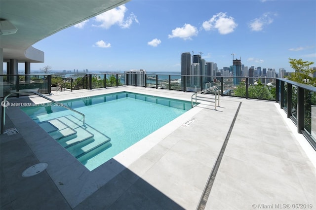 community pool featuring a view of city