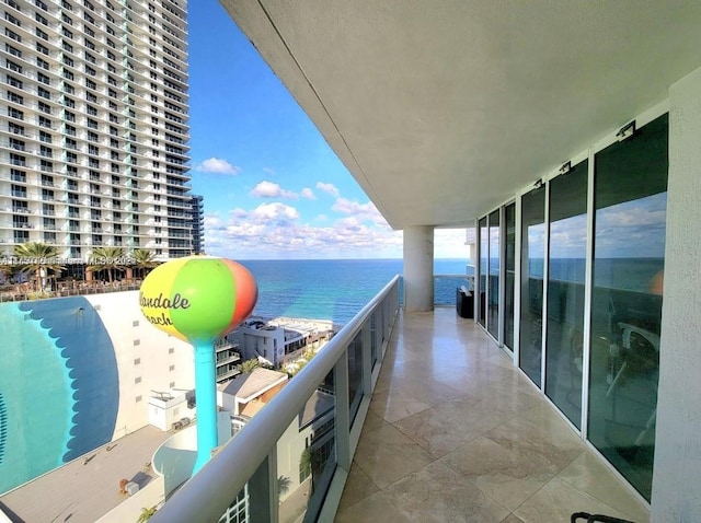 balcony featuring a water view