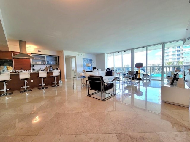 living room featuring marble finish floor and floor to ceiling windows