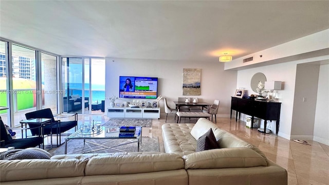 1800 S Ocean Dr Unit 1510, Hallandale Beach, FL 33009 - living room featuring baseboards, healthy amount of natural light, expansive windows, and light tile patterned floors