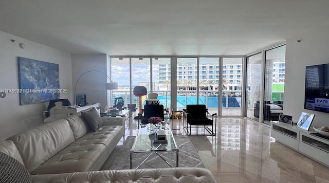 living room featuring floor to ceiling windows and a wealth of natural light