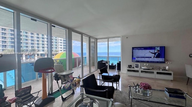 living area with floor to ceiling windows and baseboards