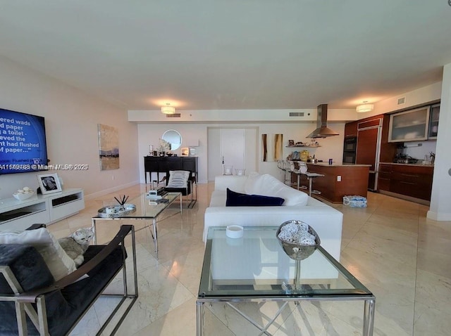 living room featuring marble finish floor, visible vents, and baseboards