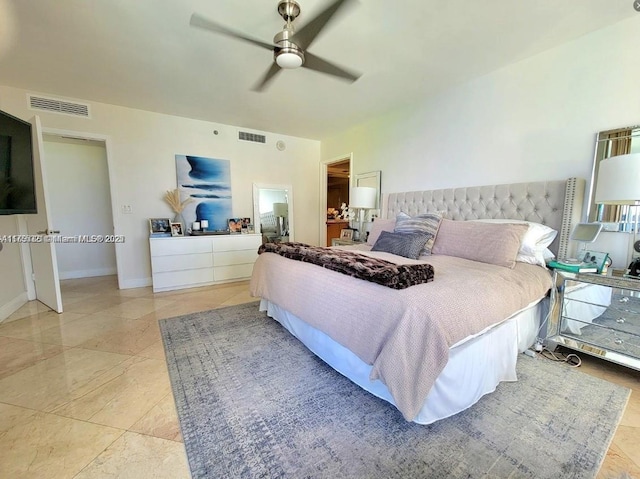 bedroom with ceiling fan, visible vents, and baseboards