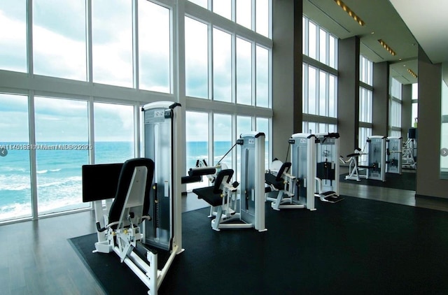 gym featuring a water view