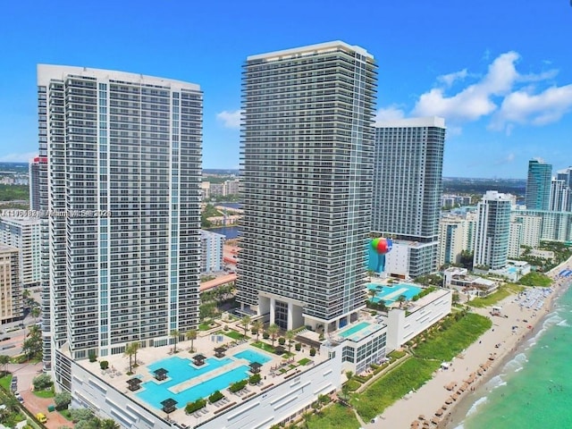 city view featuring a water view and a view of the beach