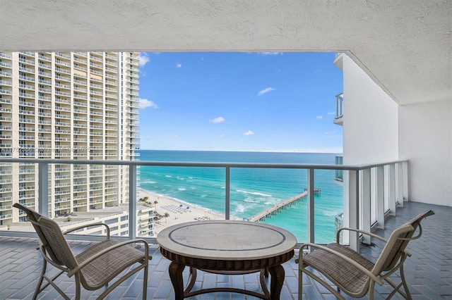 balcony featuring a water view