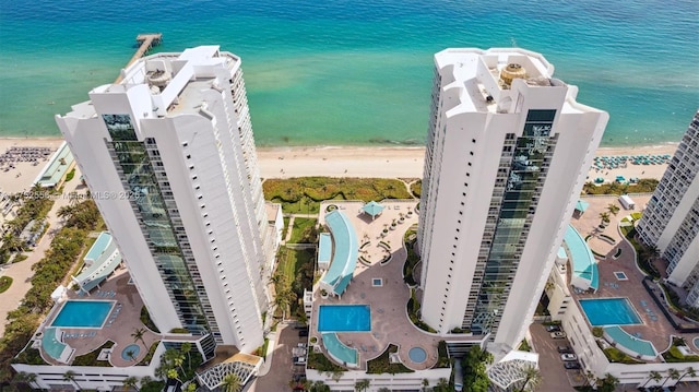 bird's eye view featuring a beach view and a water view