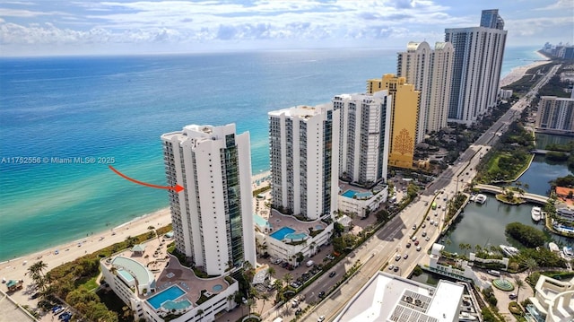 aerial view featuring a water view and a city view