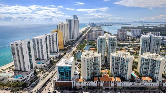 bird's eye view featuring a water view and a view of city