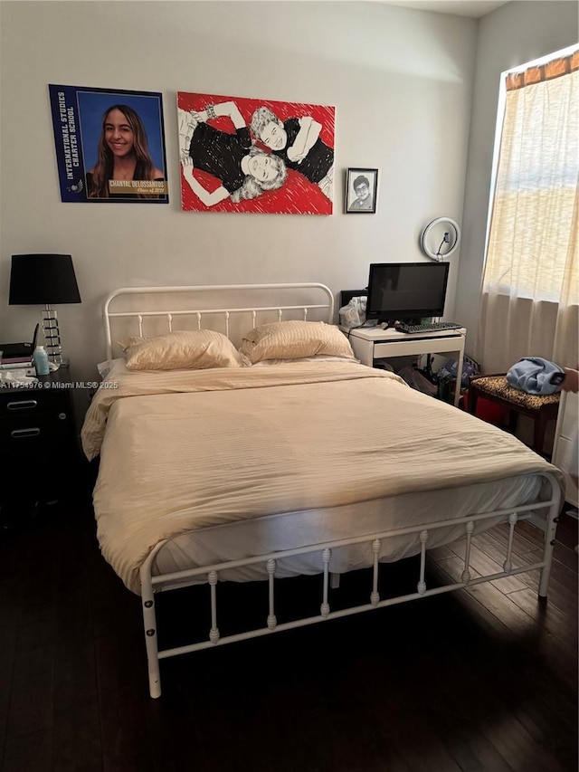 bedroom featuring wood finished floors