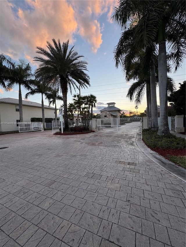 view of street featuring a gate and a gated entry