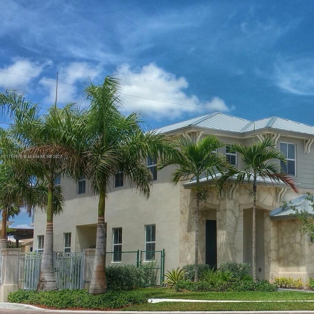 view of building exterior with fence